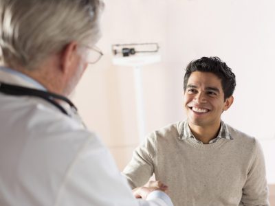 Joyous patient speaking with provider